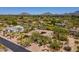 Breathtaking aerial view of a desert home with a pool, guest house and mountain views at 22469 N 79Th Pl, Scottsdale, AZ 85255