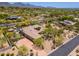 Desert estate featuring a luxurious pool, putting green, spacious driveway, and desert surroundings at 22469 N 79Th Pl, Scottsdale, AZ 85255