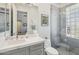 Stylish bathroom featuring glass block shower, modern vanity, and tile flooring at 22469 N 79Th Pl, Scottsdale, AZ 85255
