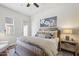 Comfortable bedroom featuring a rustic wooden bed frame, stylish nightstand, and serene artwork at 22469 N 79Th Pl, Scottsdale, AZ 85255