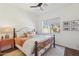 Cozy bedroom with ceiling fan, neutral decor, and natural light from window at 22469 N 79Th Pl, Scottsdale, AZ 85255