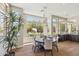 Bright dining area with large windows showcasing the backyard and pool at 22469 N 79Th Pl, Scottsdale, AZ 85255