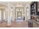 Elegant foyer with hardwood floors, custom ceiling, and decorative lighting fixture at 22469 N 79Th Pl, Scottsdale, AZ 85255