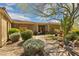 Charming front entrance showcasing stone accents, desert landscaping and a brick walkway at 22469 N 79Th Pl, Scottsdale, AZ 85255