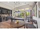 This game room features a pool table, a full bar with a wine fridge, and seating for entertaining at 22469 N 79Th Pl, Scottsdale, AZ 85255