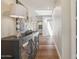 Hallway featuring hardwood floors, recessed lighting, and accent cabinet with decorative lamps at 22469 N 79Th Pl, Scottsdale, AZ 85255