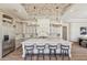 Bright kitchen featuring a marble island, breakfast bar, and stainless steel appliances at 22469 N 79Th Pl, Scottsdale, AZ 85255