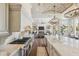 Gourmet kitchen with brick ceiling, professional gas range, island with marble countertops, and open floor plan at 22469 N 79Th Pl, Scottsdale, AZ 85255