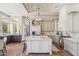Gourmet kitchen features a large island, stainless steel appliances, and stunning brick barrel ceiling with a chandelier at 22469 N 79Th Pl, Scottsdale, AZ 85255