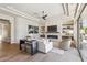 Comfortable living room featuring a fireplace, custom shelving, and natural light at 22469 N 79Th Pl, Scottsdale, AZ 85255