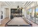 Entertainer's dream with a pool table, bar, and seamless indoor-outdoor flow at 22469 N 79Th Pl, Scottsdale, AZ 85255