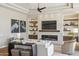 Comfortable living room featuring a fireplace, built-in shelves, and modern decor at 22469 N 79Th Pl, Scottsdale, AZ 85255