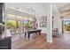 Bright and airy living room boasting natural light, hardwood floors, and outdoor access at 22469 N 79Th Pl, Scottsdale, AZ 85255