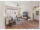 Comfortable living room with hardwood floors, large windows, and neutral color palette at 22469 N 79Th Pl, Scottsdale, AZ 85255