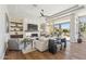 Open living room with fireplace, built-in shelving, and access to the outdoor living space at 22469 N 79Th Pl, Scottsdale, AZ 85255