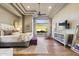 This spacious main bedroom features hardwood floors, a sitting area, and recessed lighting throughout at 22469 N 79Th Pl, Scottsdale, AZ 85255