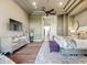 A hardwood-floored main bedroom showing a modern dresser and neutral decor at 22469 N 79Th Pl, Scottsdale, AZ 85255