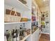 Walk-in pantry offering plenty of storage with custom shelving and cabinets at 22469 N 79Th Pl, Scottsdale, AZ 85255