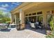 Inviting covered patio with ample seating, dining area, and decorative plants for outdoor relaxation at 22469 N 79Th Pl, Scottsdale, AZ 85255