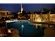 Night view of an inviting pool featuring integrated lighting and lush desert landscaping at 22469 N 79Th Pl, Scottsdale, AZ 85255
