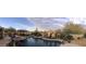 Beautiful pool and outdoor living space with desert landscaping, luxurious seating, and stone accents at 22469 N 79Th Pl, Scottsdale, AZ 85255