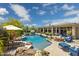 Beautiful backyard featuring a large pool, fire pit, lush landscaping and plenty of seating at 22469 N 79Th Pl, Scottsdale, AZ 85255