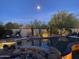 Moonlit pool area with elegant landscaping, comfortable lounge chairs, and accent lighting at 22469 N 79Th Pl, Scottsdale, AZ 85255