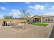An outdoor living space featuring a patio with lounge seating and a small, well-kept lawn at 22825 E Mewes Rd, Queen Creek, AZ 85142