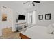 Stylishly designed bedroom with wood flooring, modern decor, and ample natural light at 22825 E Mewes Rd, Queen Creek, AZ 85142