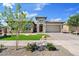 Beautiful exterior of a one-story home featuring a well-manicured lawn and desert landscaping at 22825 E Mewes Rd, Queen Creek, AZ 85142