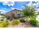 View of the home's side, showcasing the decorative landscaping and stonework at 22825 E Mewes Rd, Queen Creek, AZ 85142