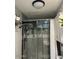 Modern bathroom with glass enclosed shower, and stylish grey tiling at 2459 E Baltimore St, Mesa, AZ 85213