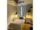 Well-lit bedroom featuring twin bed, side tables, and decoratives plants for a peaceful ambiance at 2459 E Baltimore St, Mesa, AZ 85213
