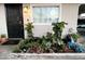 Cozy front porch with a decorated flower bed and stylish door at 2459 E Baltimore St, Mesa, AZ 85213