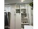 Bright kitchen featuring stainless steel refrigerator and ample white cabinet space at 2459 E Baltimore St, Mesa, AZ 85213