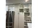 Bright kitchen featuring stainless steel refrigerator and ample white cabinet space at 2459 E Baltimore St, Mesa, AZ 85213