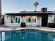 Inviting backyard with a sparkling pool and covered patio, perfect for relaxation and entertaining at 2459 E Baltimore St, Mesa, AZ 85213