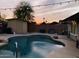Relaxing backyard pool with desert landscaping and vibrant sunset at 2459 E Baltimore St, Mesa, AZ 85213