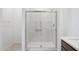 Modern bathroom with a sleek glass-enclosed shower at 25473 W Graham Trl, Buckeye, AZ 85326