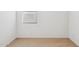 This carpeted bedroom is painted white and has a window with blinds at 25473 W Graham Trl, Buckeye, AZ 85326