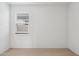 This bedroom has a window with blinds and the room is carpeted and painted white at 25473 W Graham Trl, Buckeye, AZ 85326