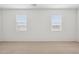 Bright bedroom with two windows offering ample natural light at 25473 W Graham Trl, Buckeye, AZ 85326