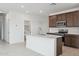 Bright kitchen with a large island and stainless steel appliances at 25473 W Graham Trl, Buckeye, AZ 85326