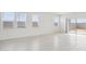 Spacious living room featuring tile floors, ample natural light, and a view of the backyard at 25473 W Graham Trl, Buckeye, AZ 85326
