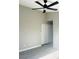 Bright bedroom featuring a ceiling fan and a closet with sliding doors at 2618 S 81St Ln, Phoenix, AZ 85043