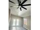 Bright dining area with stylish fan, gray vinyl floors and large glass doors for natural light at 2618 S 81St Ln, Phoenix, AZ 85043
