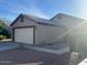 Exterior shot of a single-story home featuring a two-car garage at 2618 S 81St Ln, Phoenix, AZ 85043