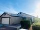 Exterior shot of a single-story home with a two-car garage and mature landscaping at 2618 S 81St Ln, Phoenix, AZ 85043