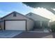 Charming single-story home with a well-maintained front yard and a two-car garage at 2618 S 81St Ln, Phoenix, AZ 85043