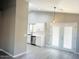 Well-lit kitchen featuring white cabinets, stainless steel appliances, and modern fixtures at 2618 S 81St Ln, Phoenix, AZ 85043